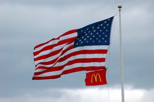 American and Mc Donald's Flags in the wind